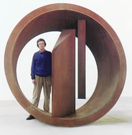 Nigel Hall with his sculpture: Within and Without, 1999 corten steel 245 x 250 x 135 cms.